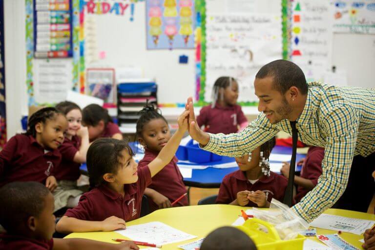 achievement first student's high five teacher