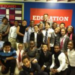 Riley Bauling with students at AF Bushwick Middle.