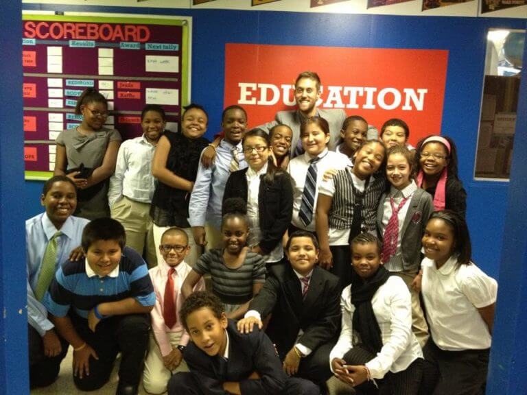 Riley Bauling with students at AF Bushwick Middle.