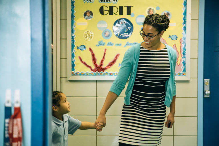 Injy Sullivan, principal of AF East New York Elementary, with a student. 