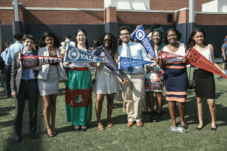 DiCo, left, with students from the AF Brooklyn High Speech & Debate Team on Senior Signing Day
