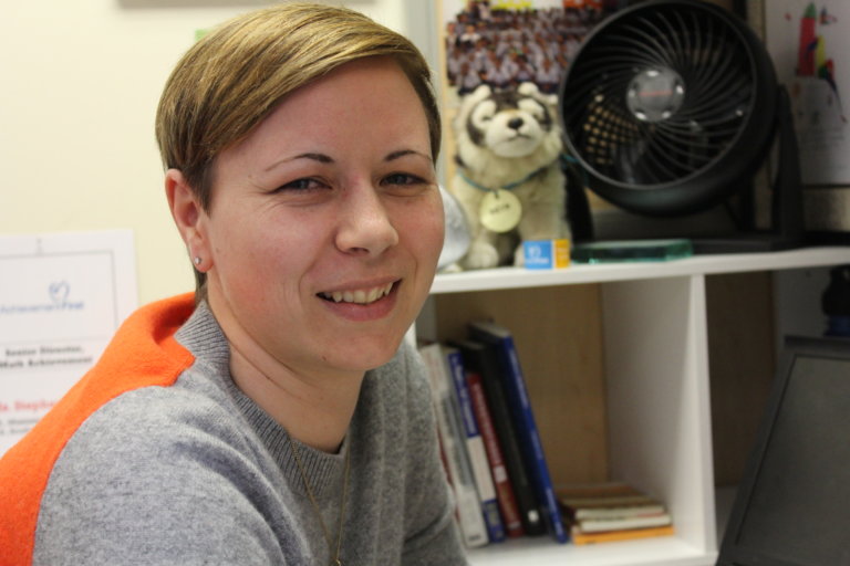 Stephanie Lyon smiling in her office.