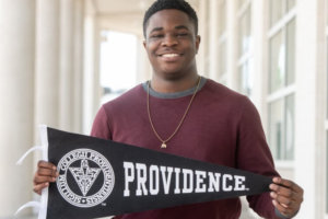 Daniel holding his Providence College banner