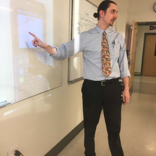 Teacher Tim Shore standing up at the board