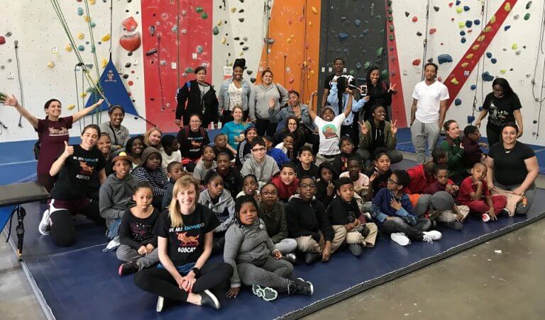 Students and teachers at a rock climbing field trip