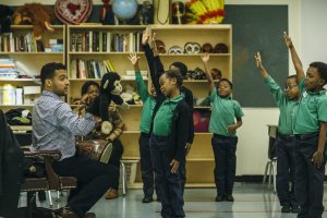 Jon Deliz and his students in drama class.