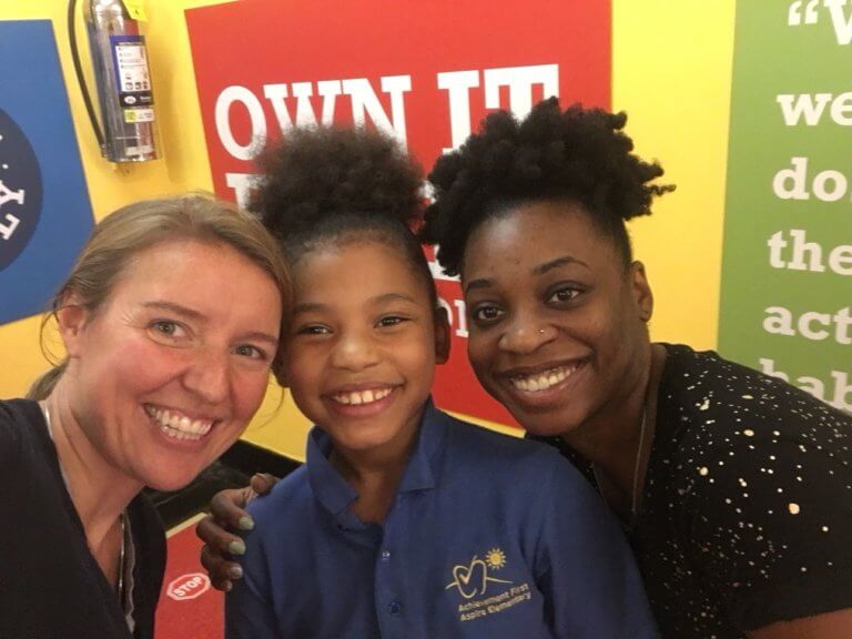 Navaeh with her teacher and principal