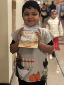 A student dressed as a book cover