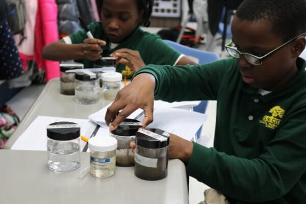 Students conduct biology experiments