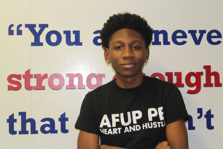 Tysheem posing in front of wall