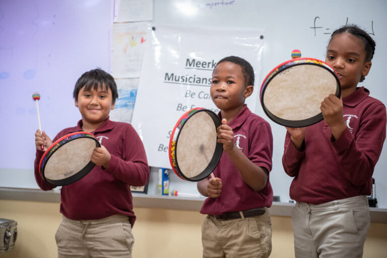 Students playing drums