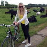 Elizabeth Harris standing with her bike