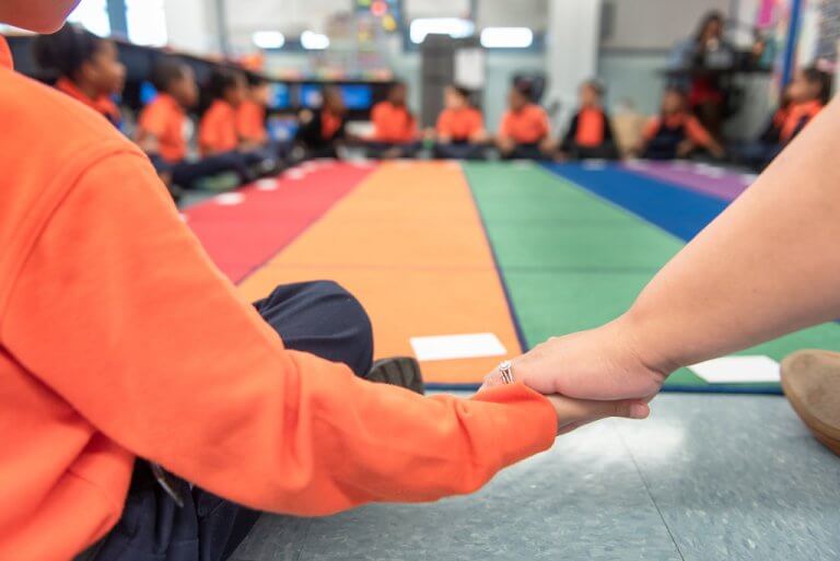 photo of kids holding hands