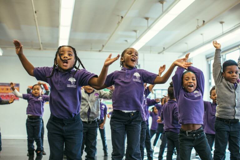 Students jumping and singing